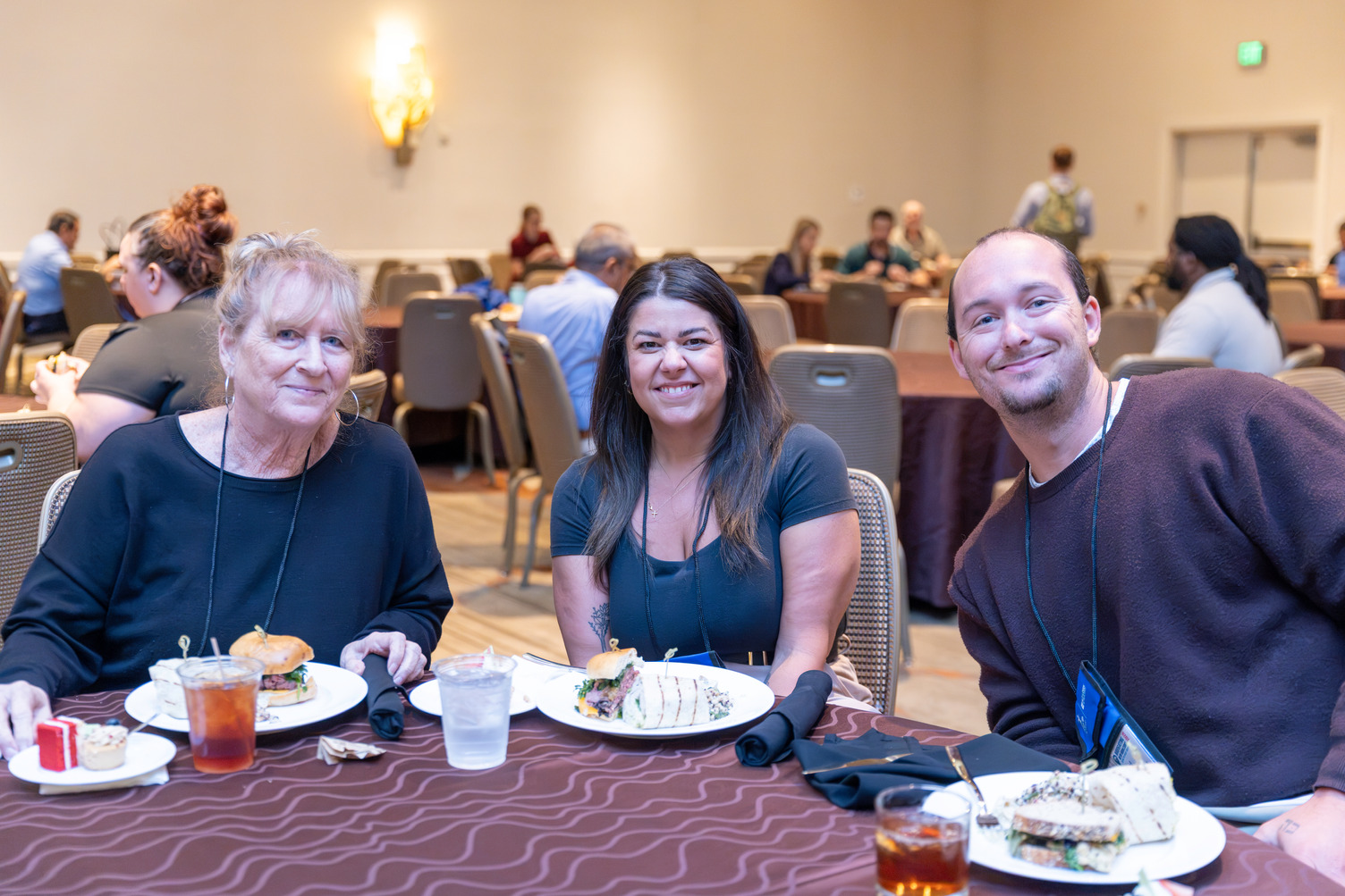 three people enjoying the networking luncheon